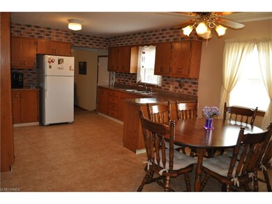 Roomy country kitchen with newer countertops and floor