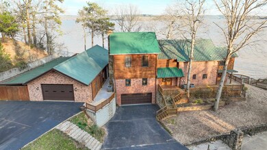 Chalet / cabin featuring brick siding, driveway, m