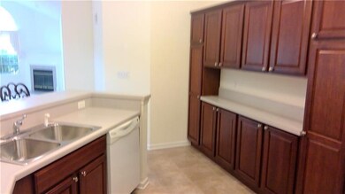 WITH AN EXTRA WALL OF CABINET STORAGE AND SERVING 