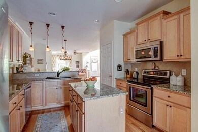 You’ll adore this kitchen:  Granite countertops, stainless steel appliances, pantry, bar seating, an island and lots of beautiful cabinetry, and one of the two laundry areas. 