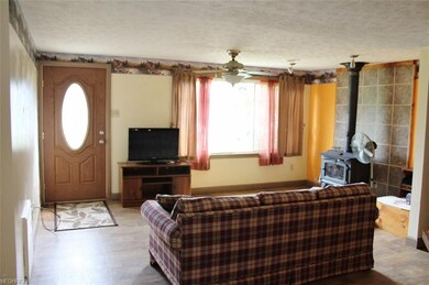 Enter through the front door into the living room.