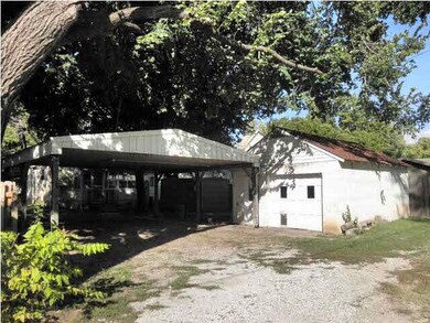 Also has alley access to carport and garage/worksh