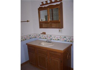 Bathroom. Nice oak vanity in large Bath area..