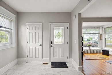 Entryway with light hardwood / wood-style floors a
