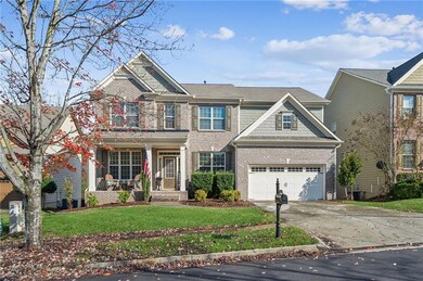 View of front facade with a porch, a garage, and a
