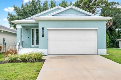Ranch-style house featuring a porch, a front lawn, stucco siding, and concrete driveway