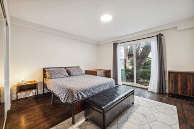 Primary bedroom with a double paned sliding glass