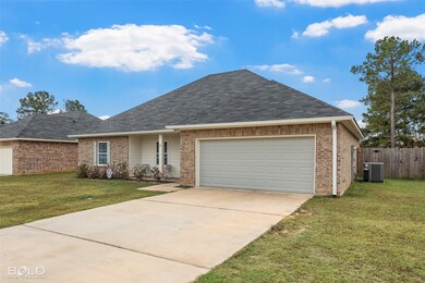 Ranch-style house featuring roof with shingles, concrete driveway, brick siding, and a garage