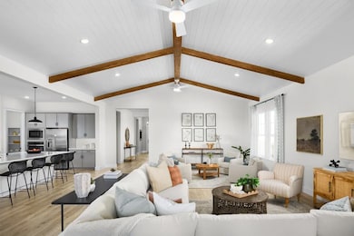 Great room with vaulted ceiling and shiplap