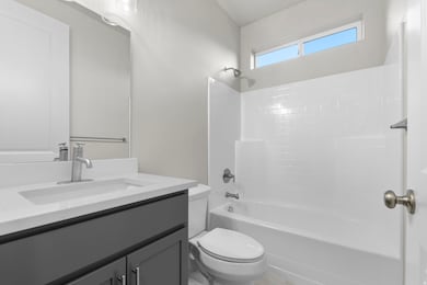 Bathroom featuring  shower combination and vanity