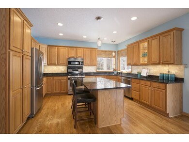 Kitchen features granite counters, stainless appli