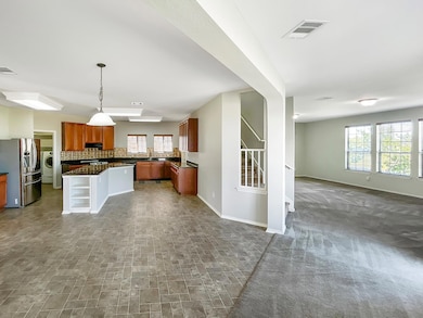 Kitchen with open floor plan, stainless steel fri