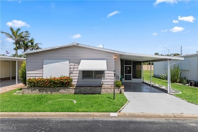 Charming curb appeal with manicured landscaping, concrete edging, and an epoxy-coated driveway.