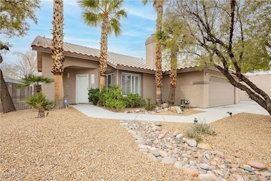 View of front of house with stucco siding, concret