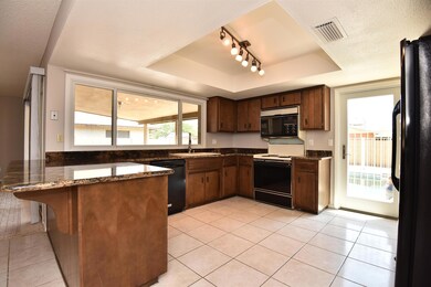 Kitchen w/black refrigerator