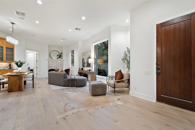 Living area featuring light wood finished floors,