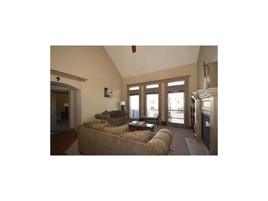 Living Room w/Fireplace and Vaulted Ceiling