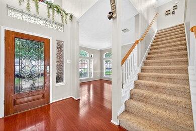 Grand Foyer Entry – Elegant staircase and soaring