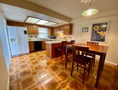 Open Kitchen has Sliding Door to Patio