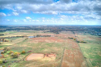 10 acres located to the right of the pond