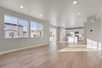 Unfurnished living room with recessed lighting, a textured ceiling, light wood-type flooring, and a chandelier