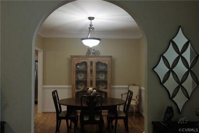 Beautiful formal dining room, with arched entryway