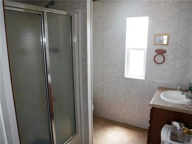 Hall bath has walk-in shower.