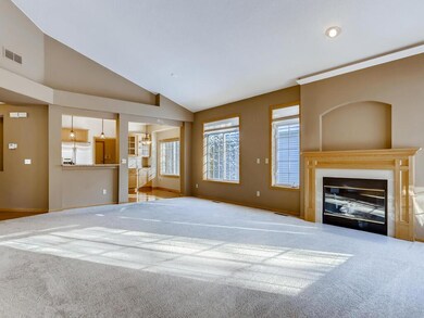 Large living area with lots of windows and gas fir