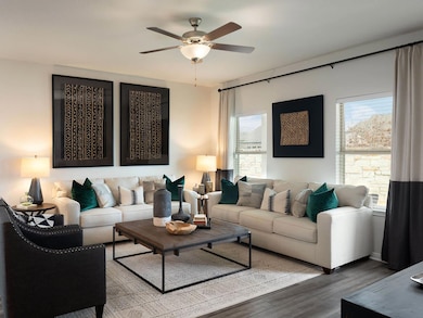 Living room with wood finished floors and a ceili