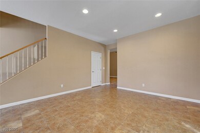 Empty room with recessed lighting and baseboards