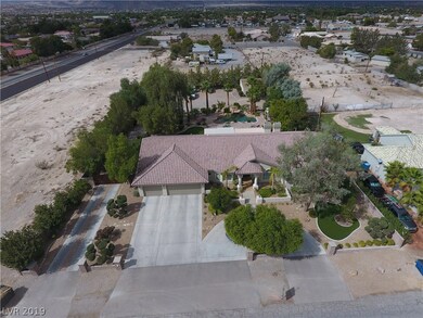 Frontal view of house showing large driveway, circ