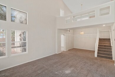 Unfurnished living room with stairway, carpet, bas