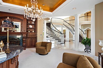 A handsome library sits off the entry and adjoins 