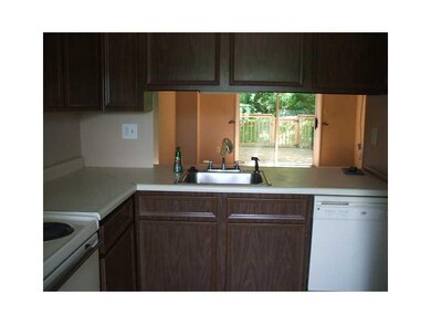 Kitchen. View from kitchen sink into the living/di