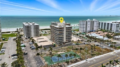 View of apartment building / complex featuring a water view - Virtually Edited Image
