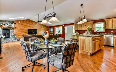 Open floor plan with gleaming hardwood flooring.