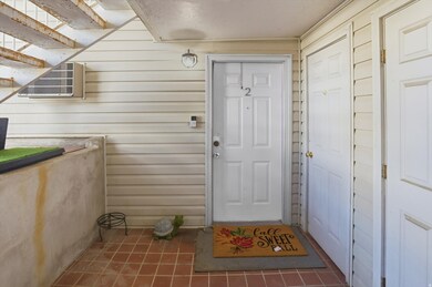 Entrance to property and view of storage shed to the right of the front door