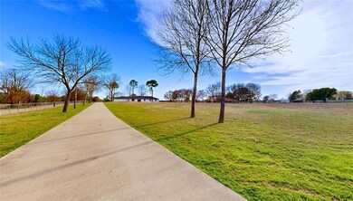 View of home's community with a yard