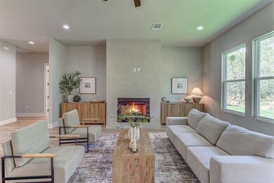 Living area featuring a premium fireplace, recess