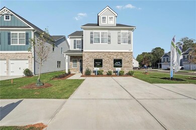 View of front of property with a garage and a fron