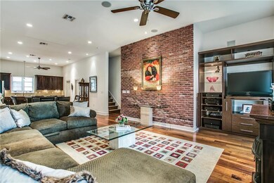 Open Floorplan with with a Brick wall and Built In