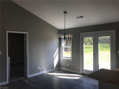 LR is open to the DR and Kitchen.  New Fixtures.  Double doors lead out to patio and private back yard.  Door to the L leads to large 4th BR.