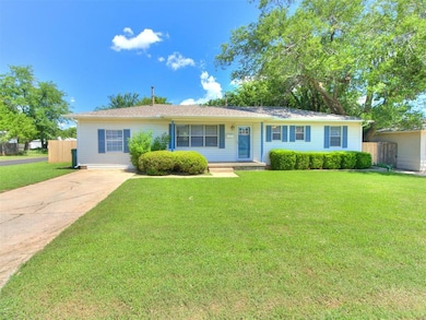 Single story home featuring concrete driveway