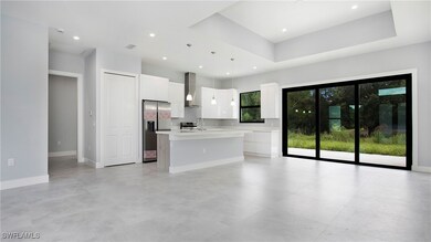 Kitchen featuring stainless steel refrigerator wit