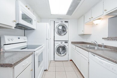 Laundry area with stacked washer / drying machine,