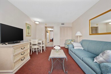 Living room featuring visible vents and dark color