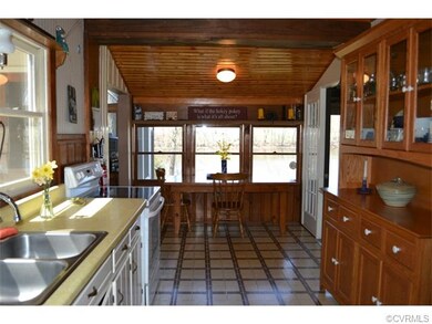 The kitchen is spacious and carries on the charm w