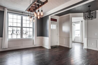 Large dining room, with waynes coating, chair rail, and thick crown molding will bring charm to your dining room while entertaining your guests.