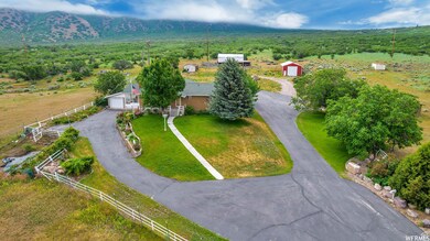 Aerial view of property and surrounding area featuring a forest