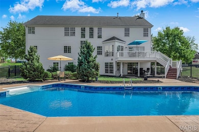 View of pool featuring a patio area, stairway, and a deck